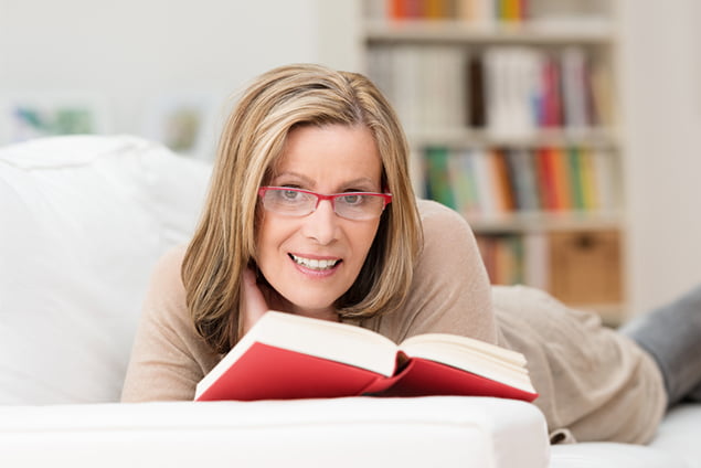 Woman Reading a Book - Refractive Lens - Freedom Eye Laser